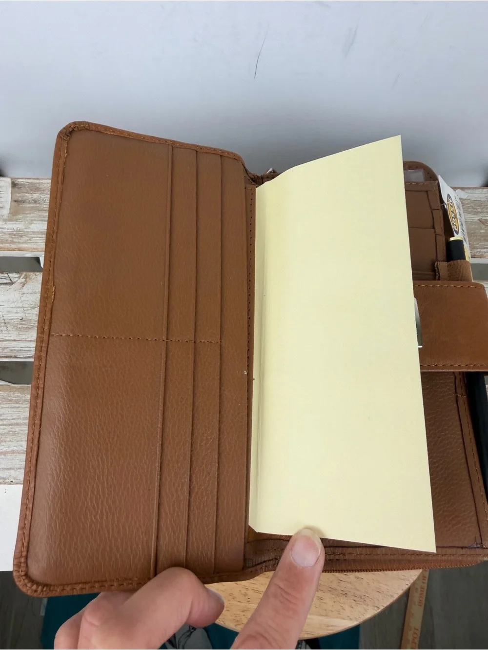 NWT Fossil Saddle leather Clutch Wallet features a secure snap closure tab
